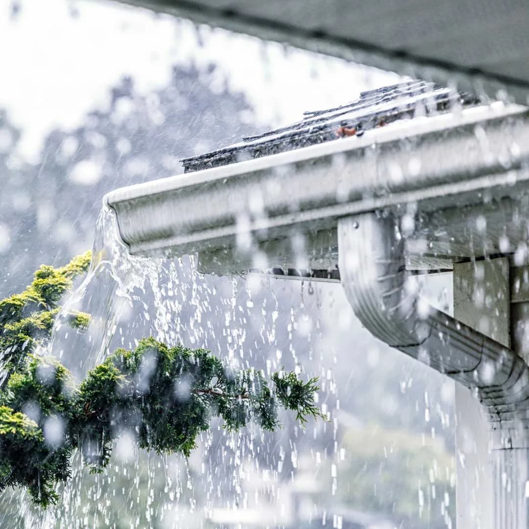 Overflowing gutter, the kind of leak Holland Home Services repairs